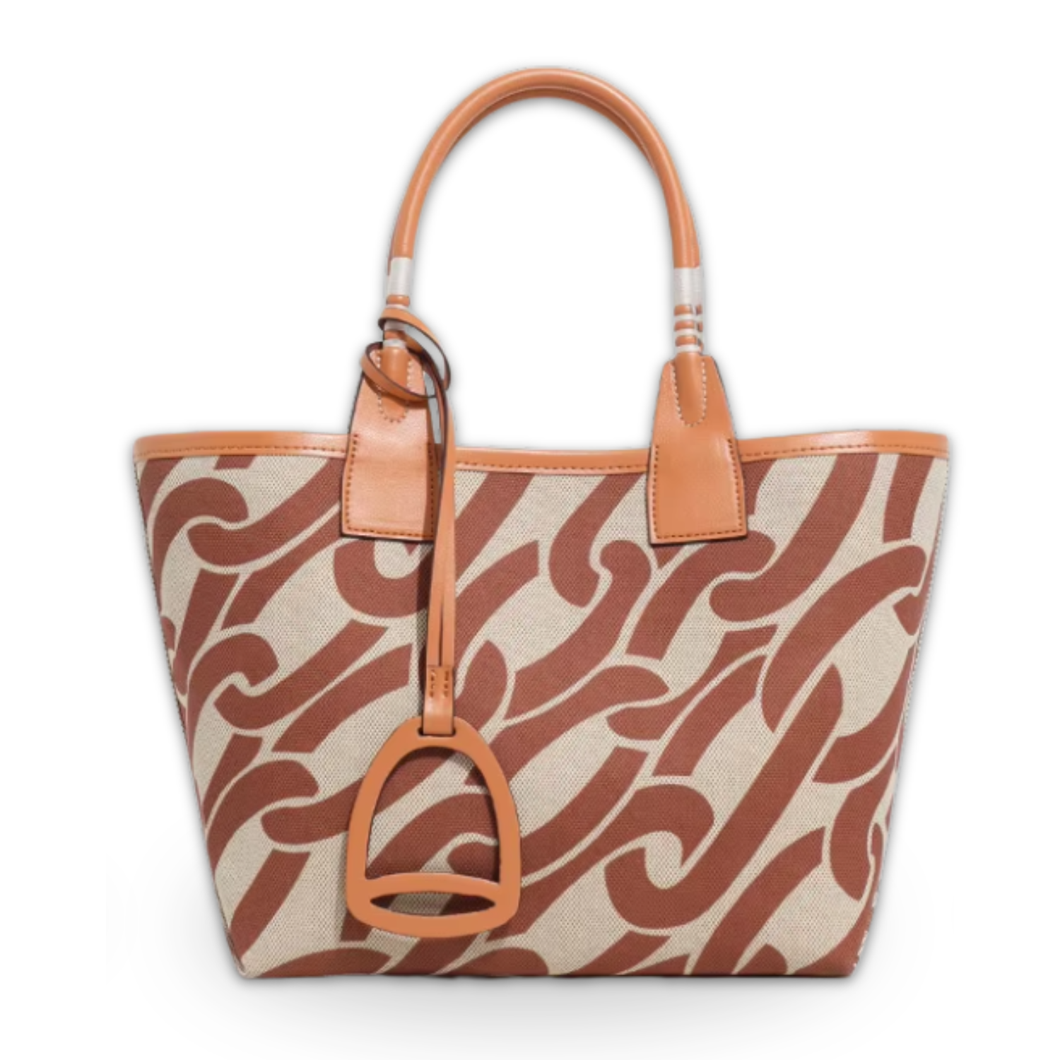 Patterned handbag with tan leather accents on a white background