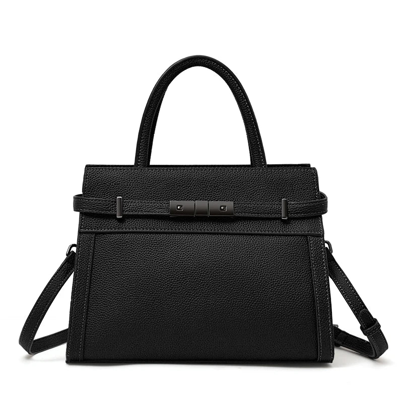 Black handbag with a strap on a white background