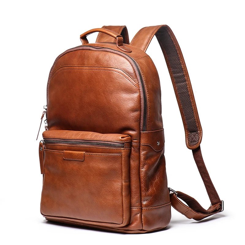 Brown leather backpack on a white background