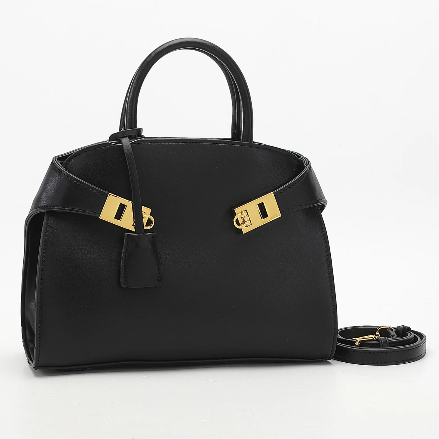 Black handbag with gold hardware on a white background