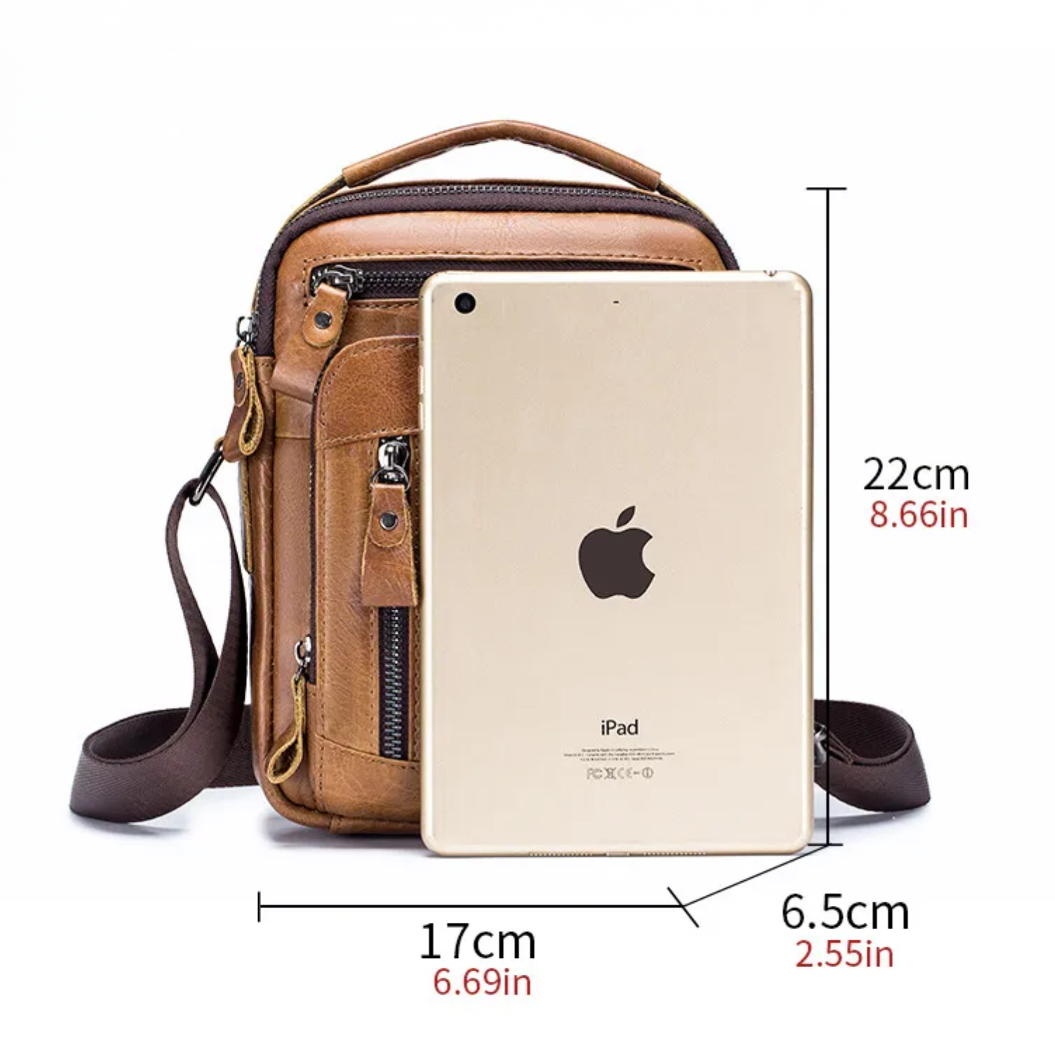 Brown leather crossbody bag with an Apple iPad and measurements on a white background