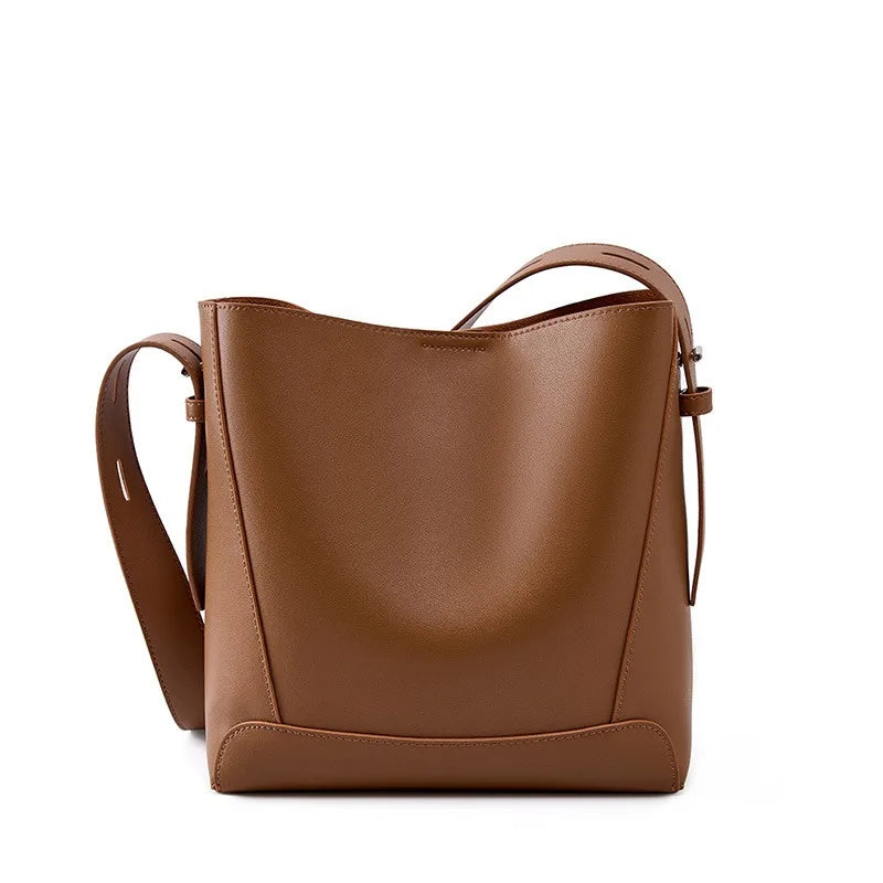 Brown leather handbag on a white background