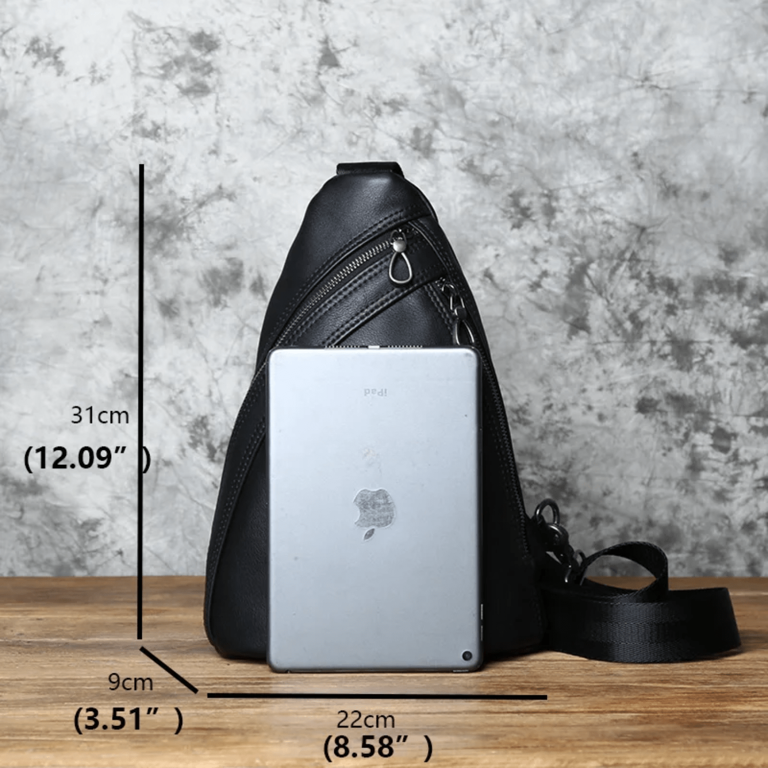 black chest bag with measurements and Ipad to compare
