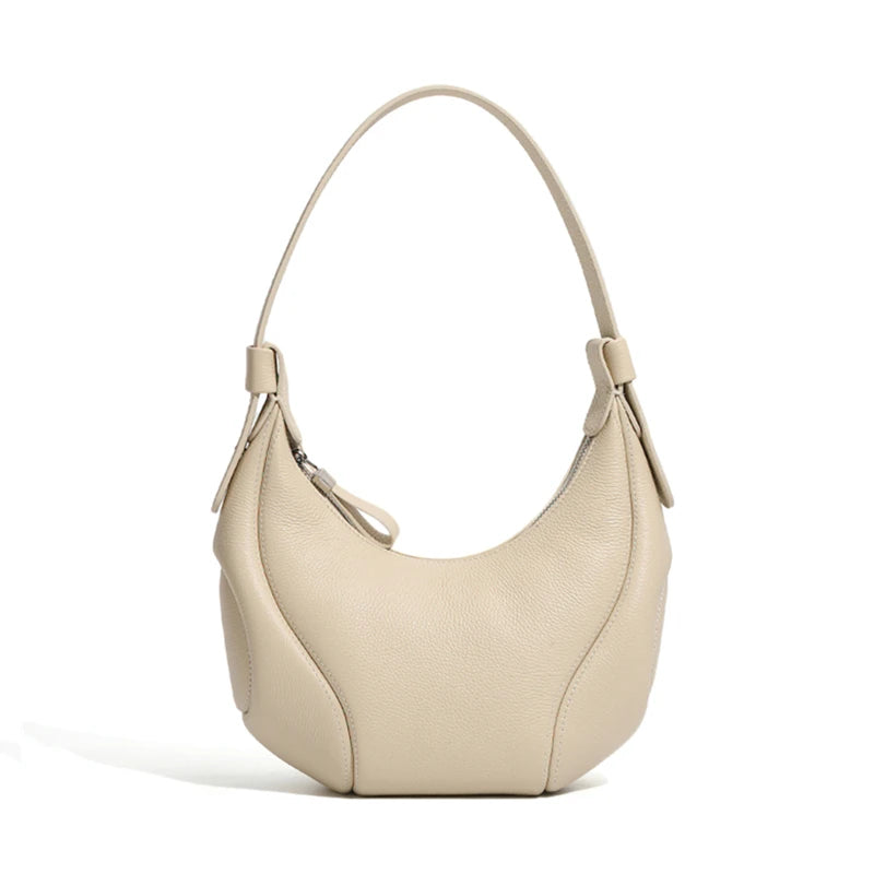 Beige handbag on a white background