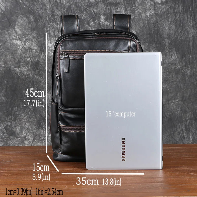 Black backpack with a Samsung laptop on a wooden surface and gray background