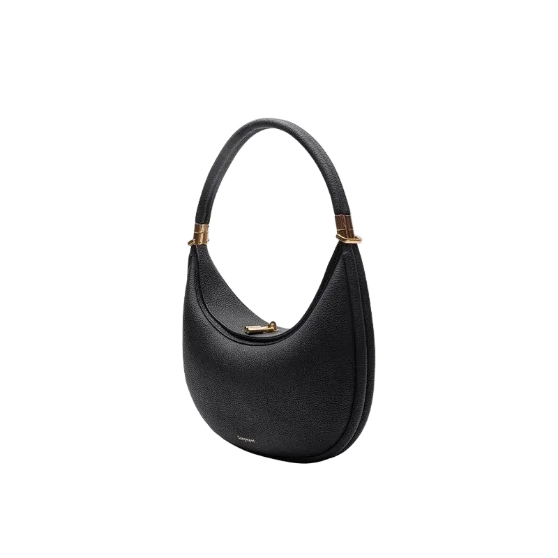Black handbag with gold accents on a white background
