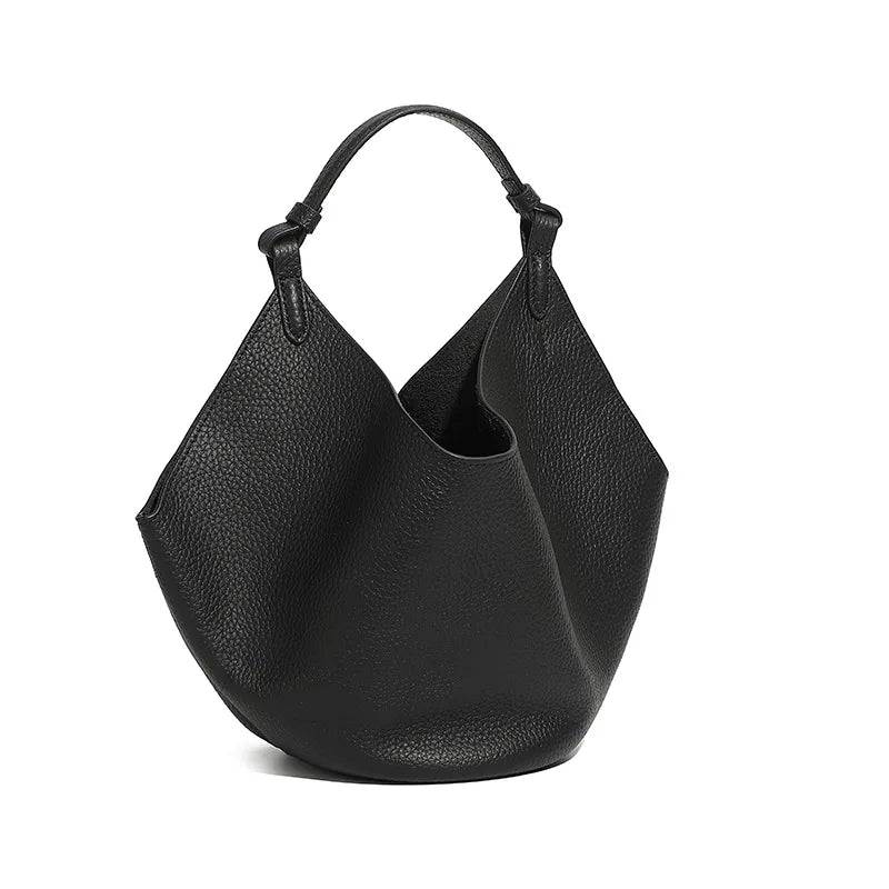 Black leather handbag on a white background