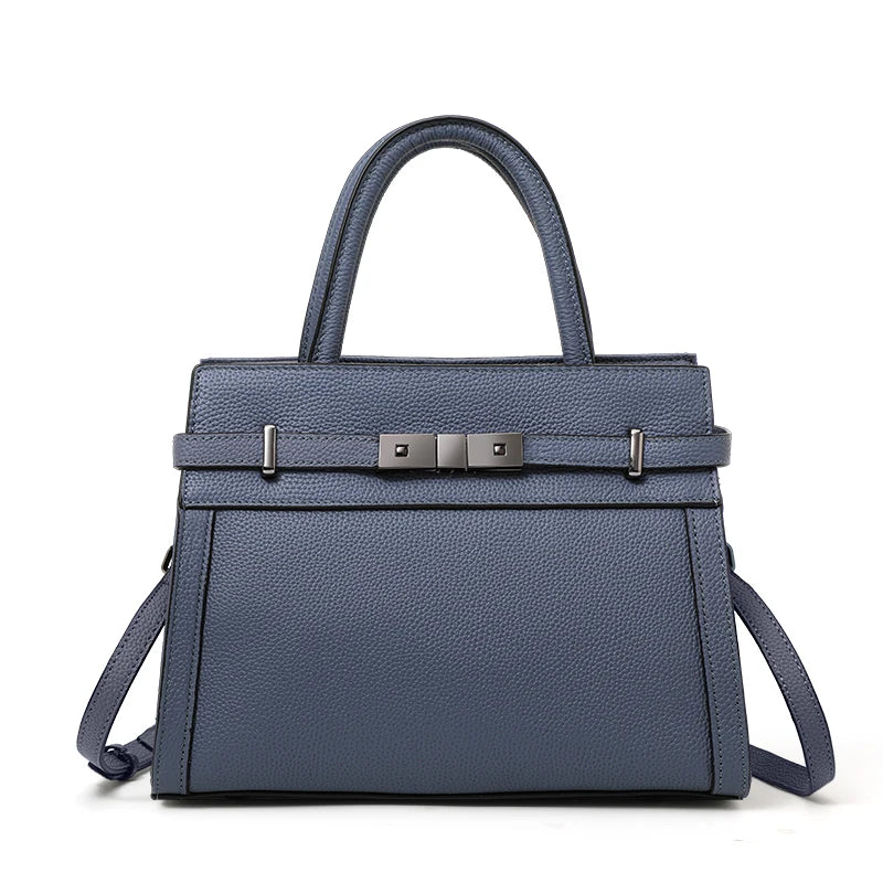 Blue handbag with a silver buckle on a white background