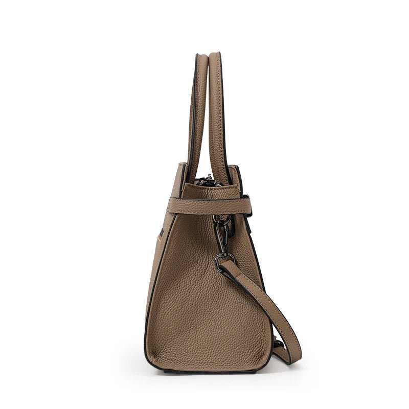Brown handbag with a shoulder strap on a white background