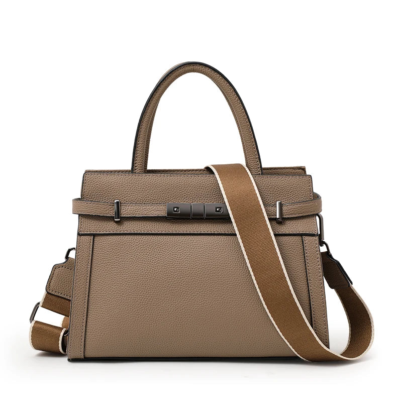 Brown handbag with a strap on a white background