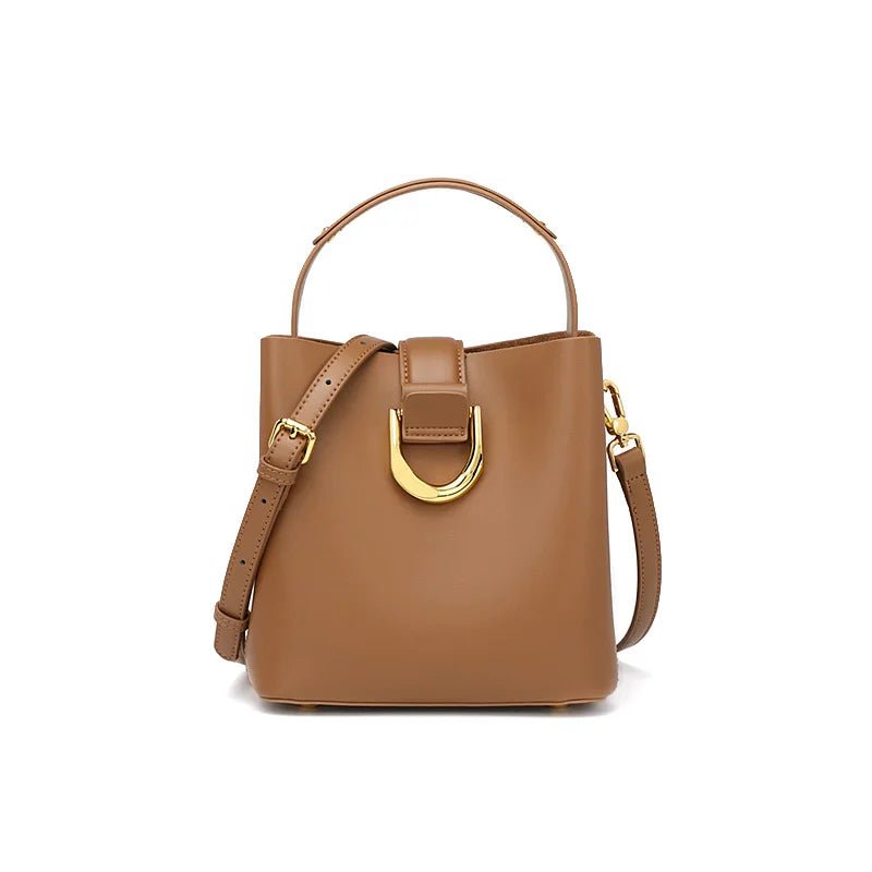 Brown handbag with gold accents on a white background