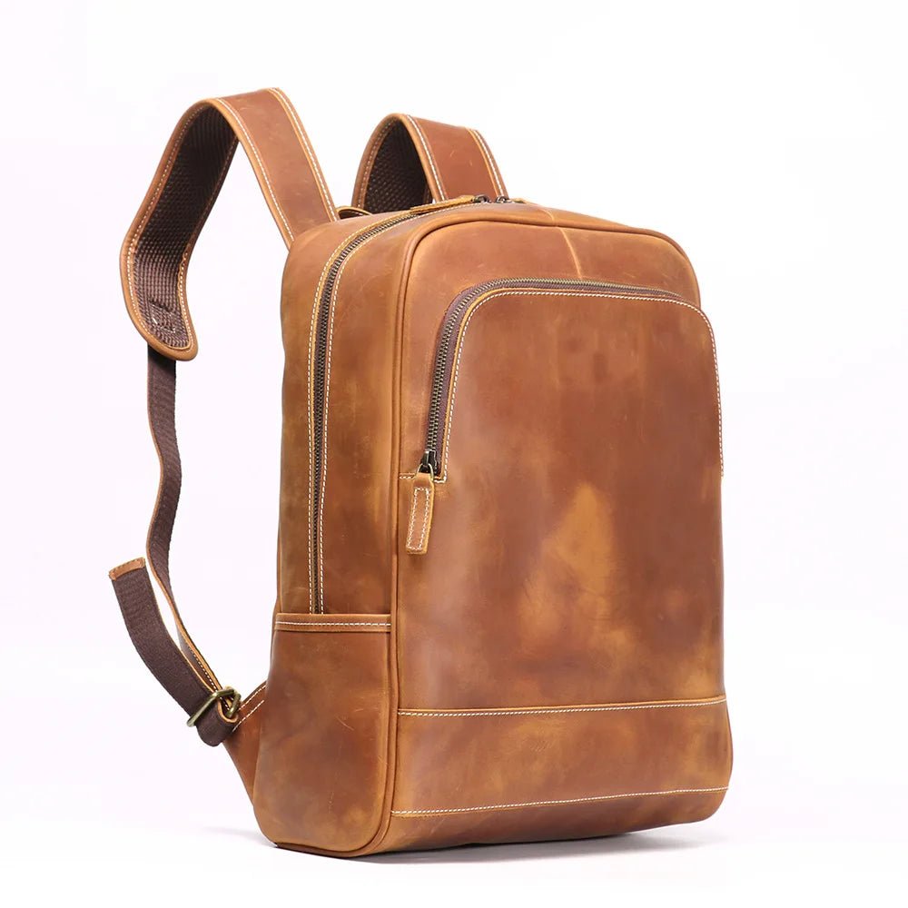 Brown leather backpack on a white background