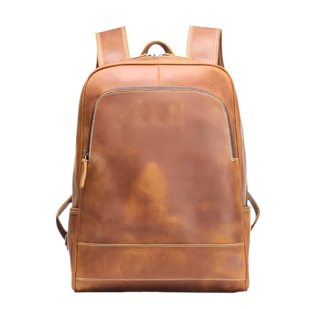 Brown leather backpack on a white background