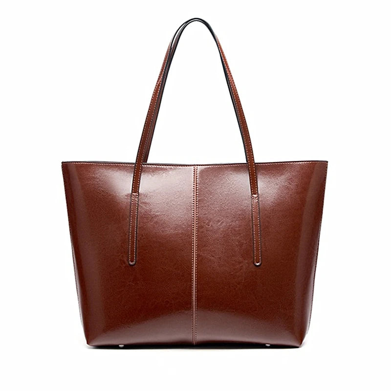 Brown leather tote bag on a white background