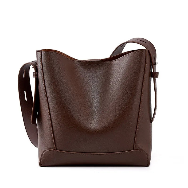 Brown leather handbag on a white background