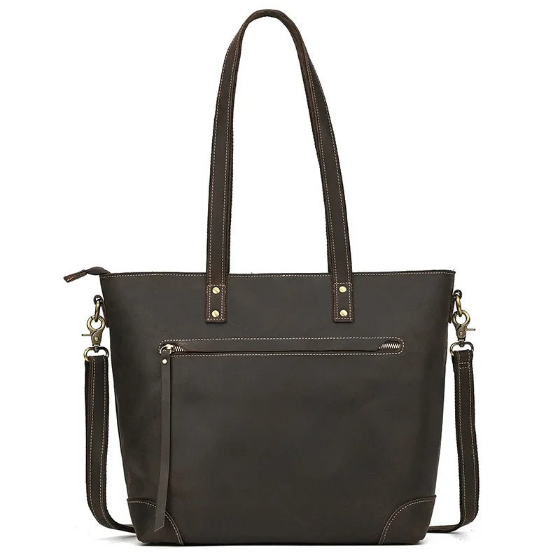 Dark brown leather handbag with shoulder strap on a white background