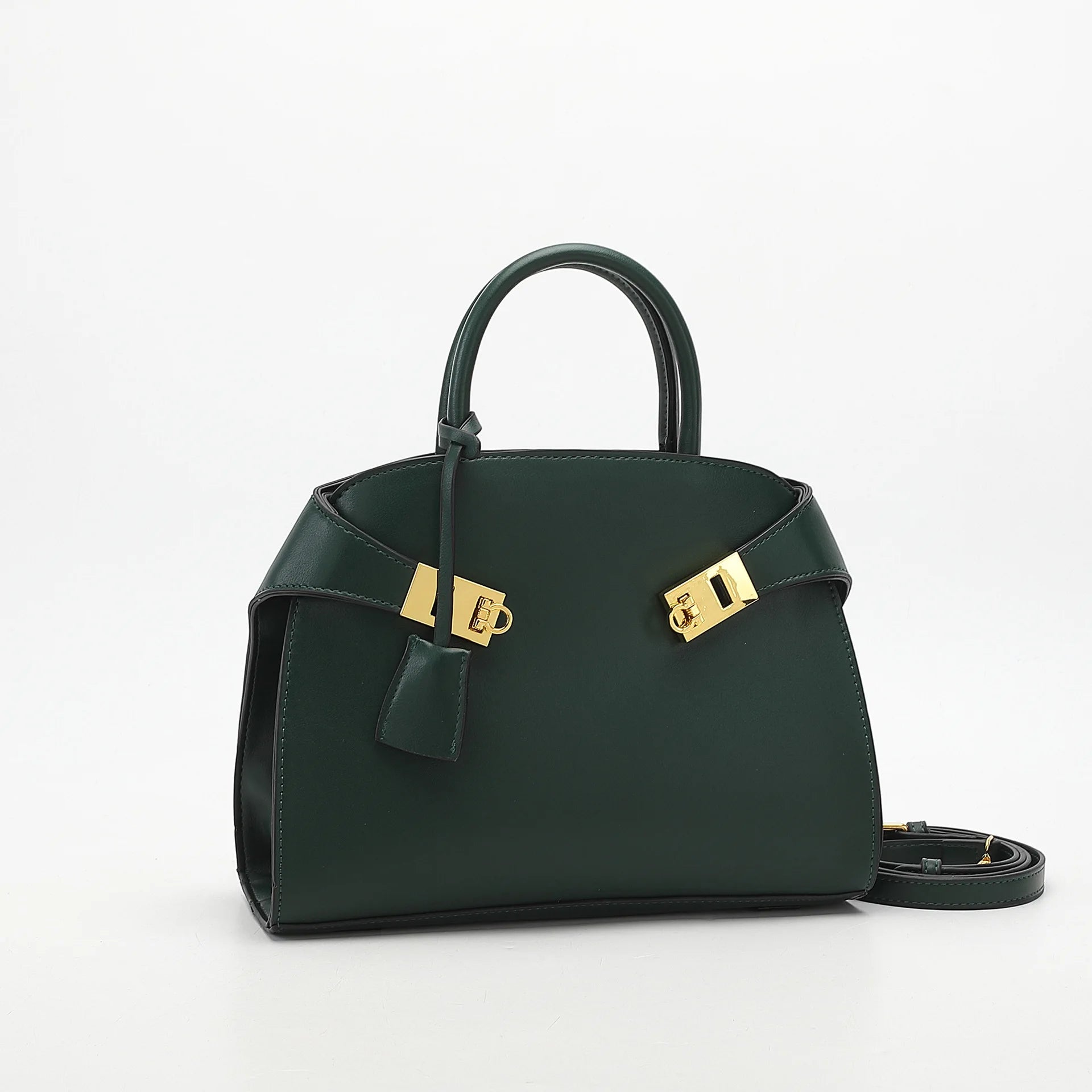Green handbag with gold accents on a white background