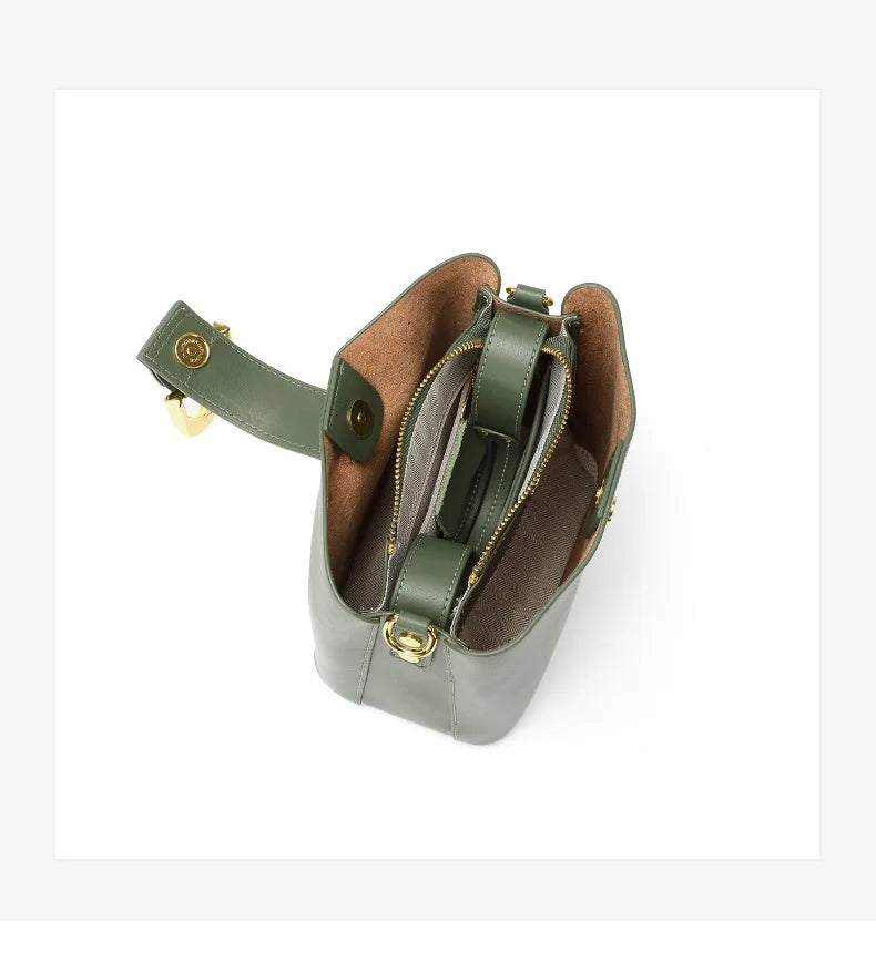 Green leather bag with a zipper on a white background