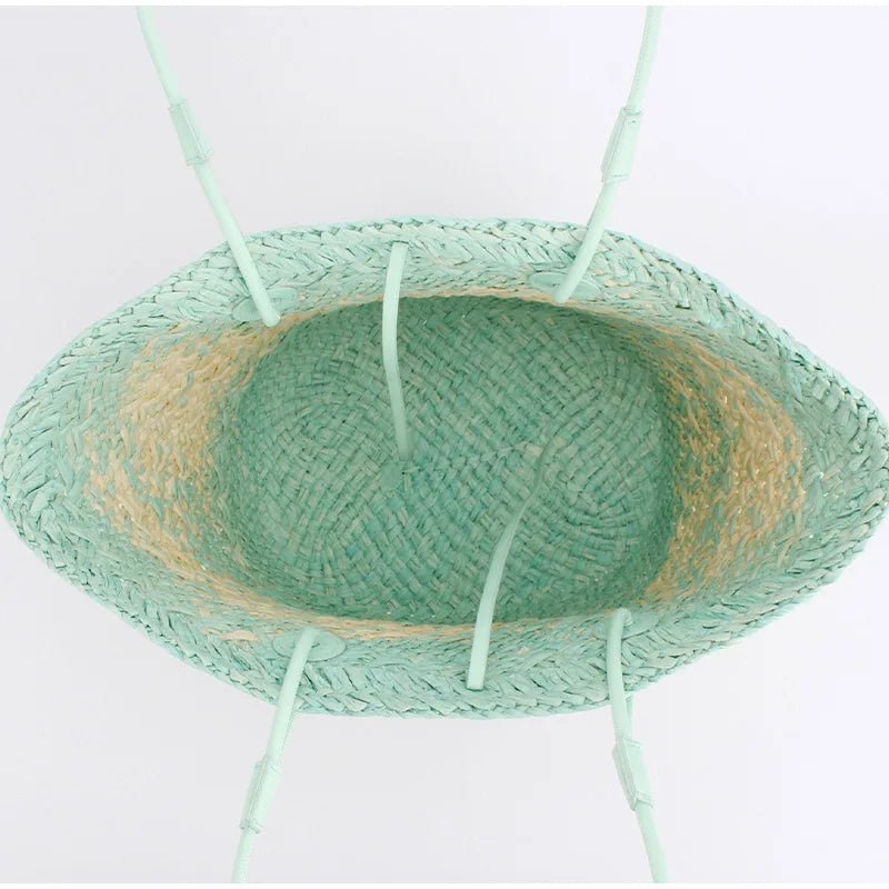 Green straw hat on a white background