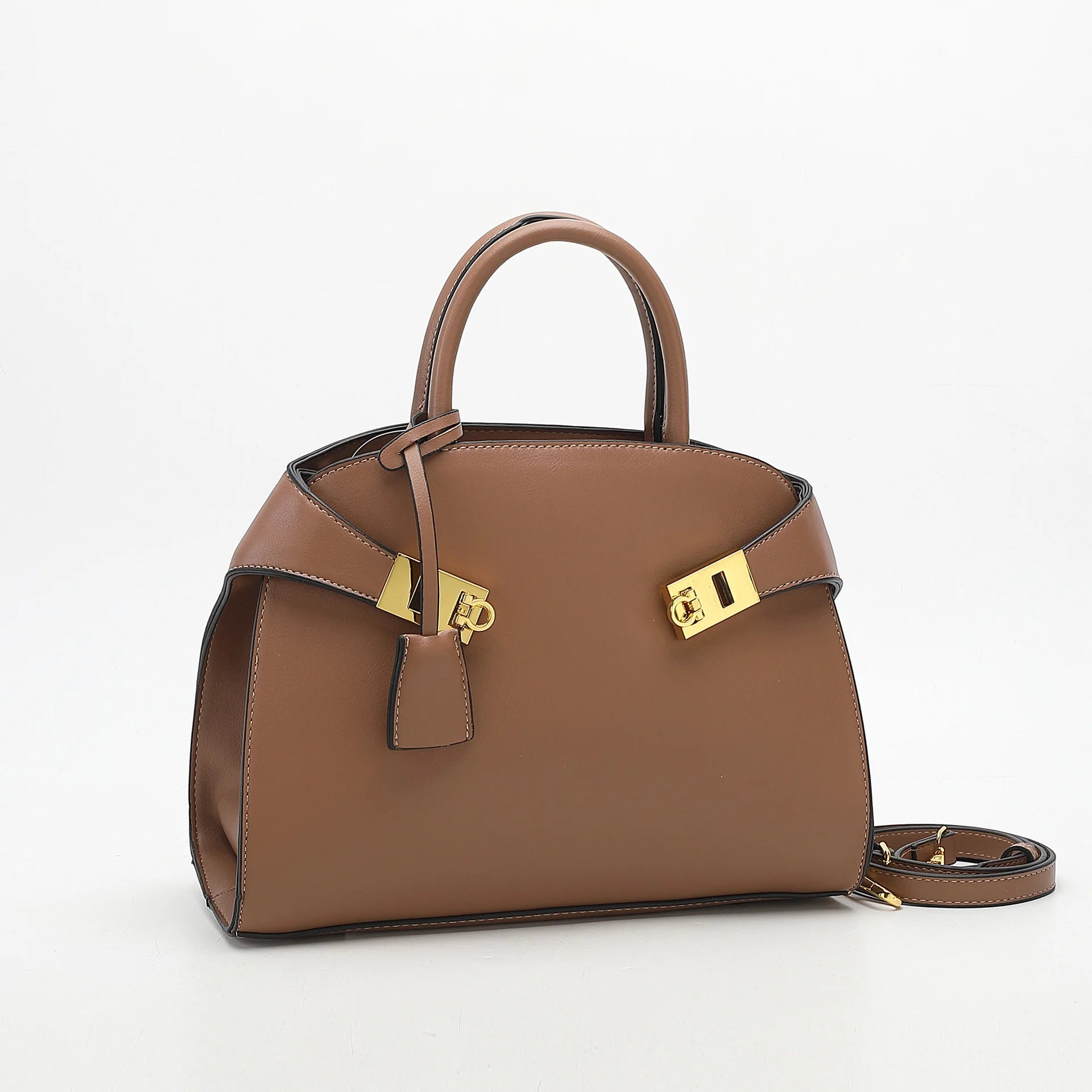 Light Brown handbag with gold hardware on a white background