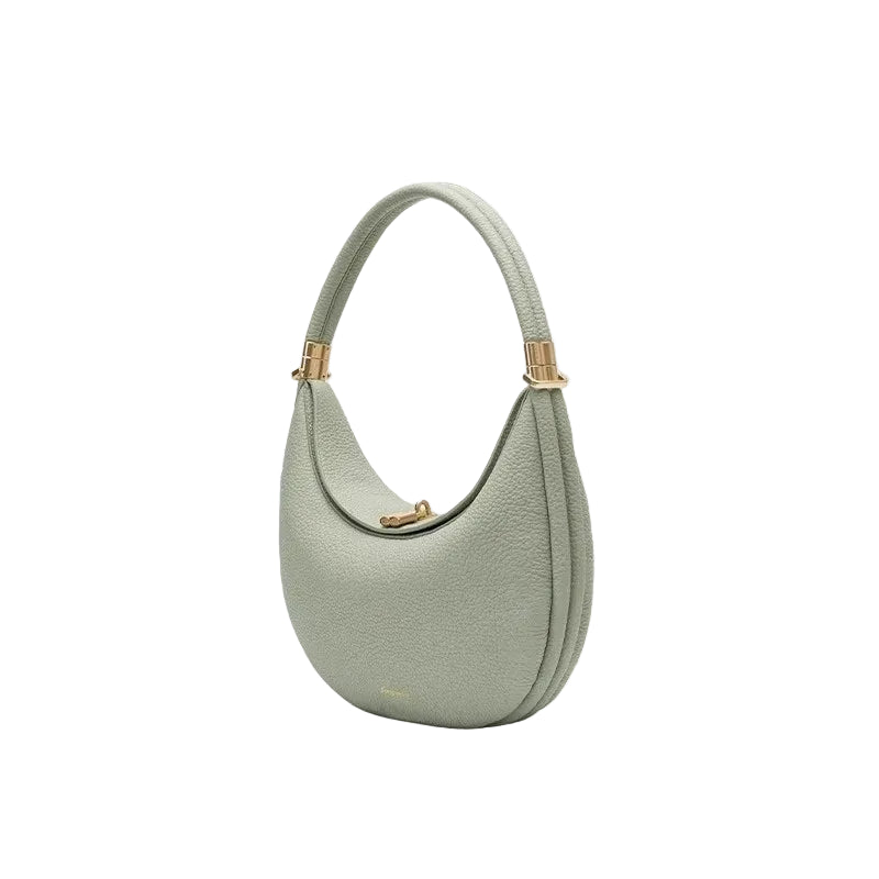 Light green handbag with gold accents on a white background