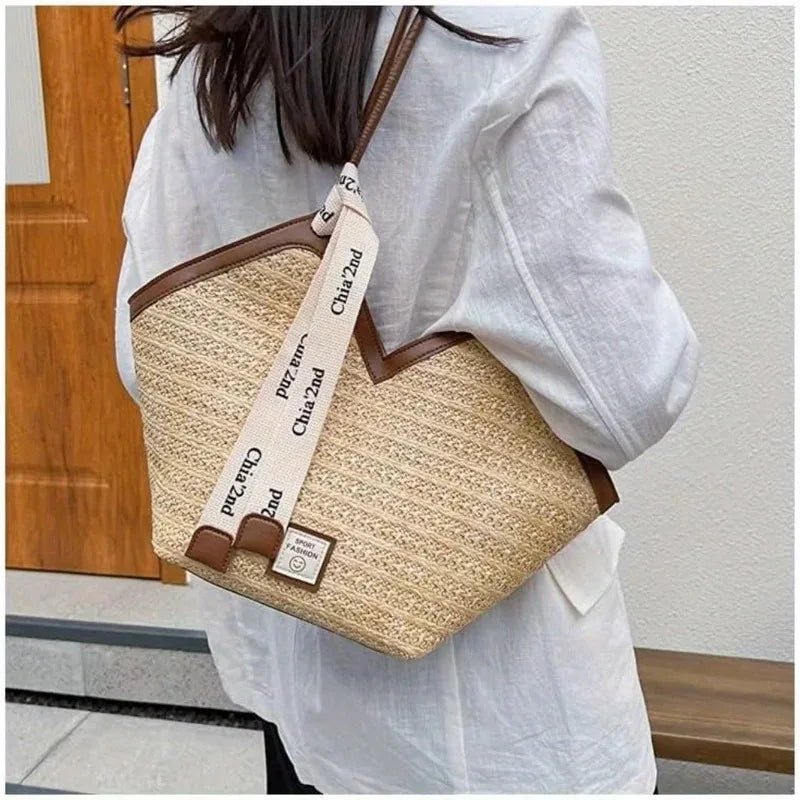 Person wearing a straw handbag with a strap displaying 'Chic 2nd' brand name.
