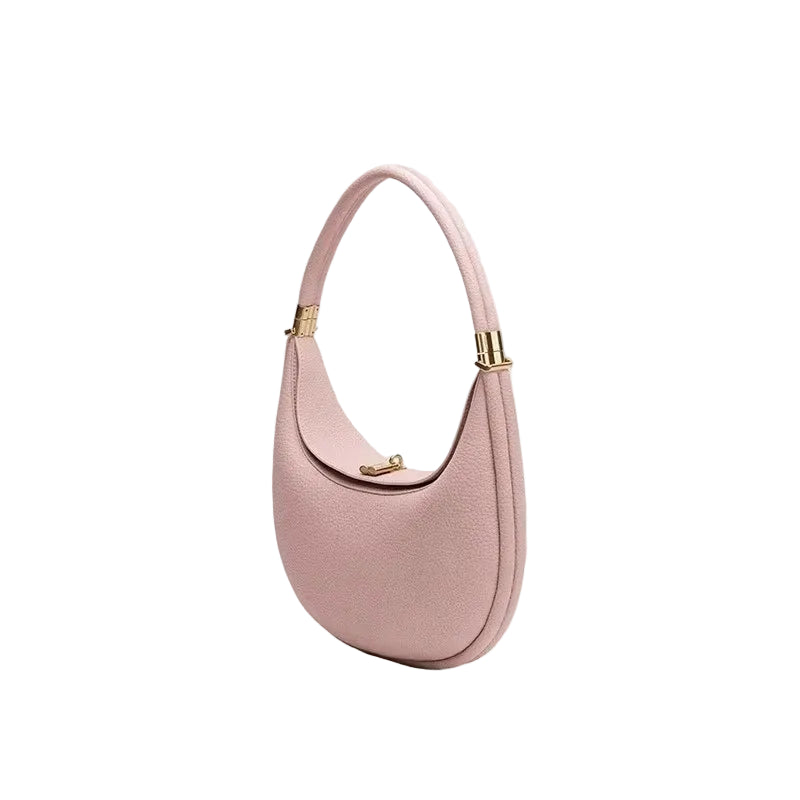 Pink handbag with gold accents on a white background