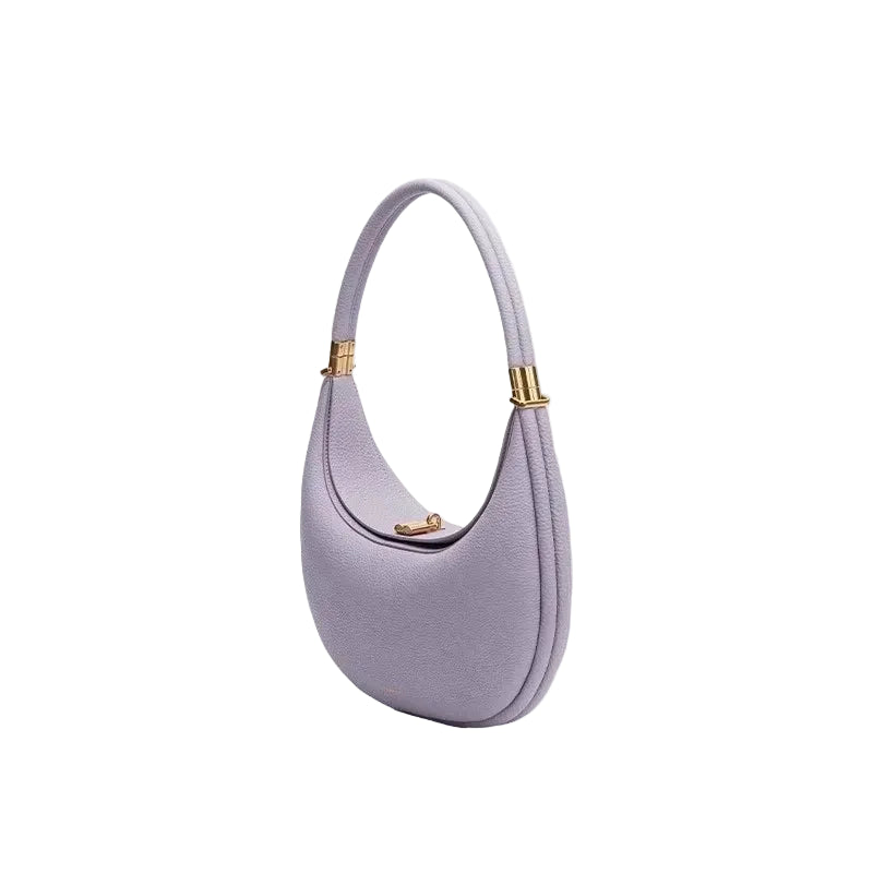 Purple handbag with gold accents on a white background