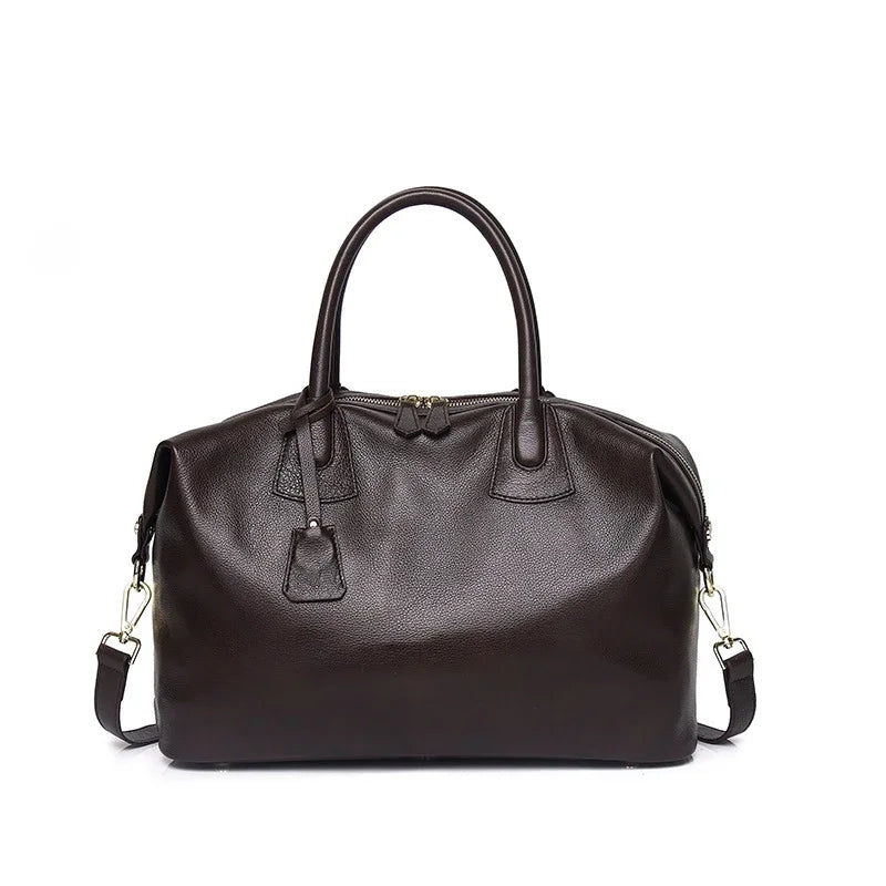 Black leather handbag on a white background