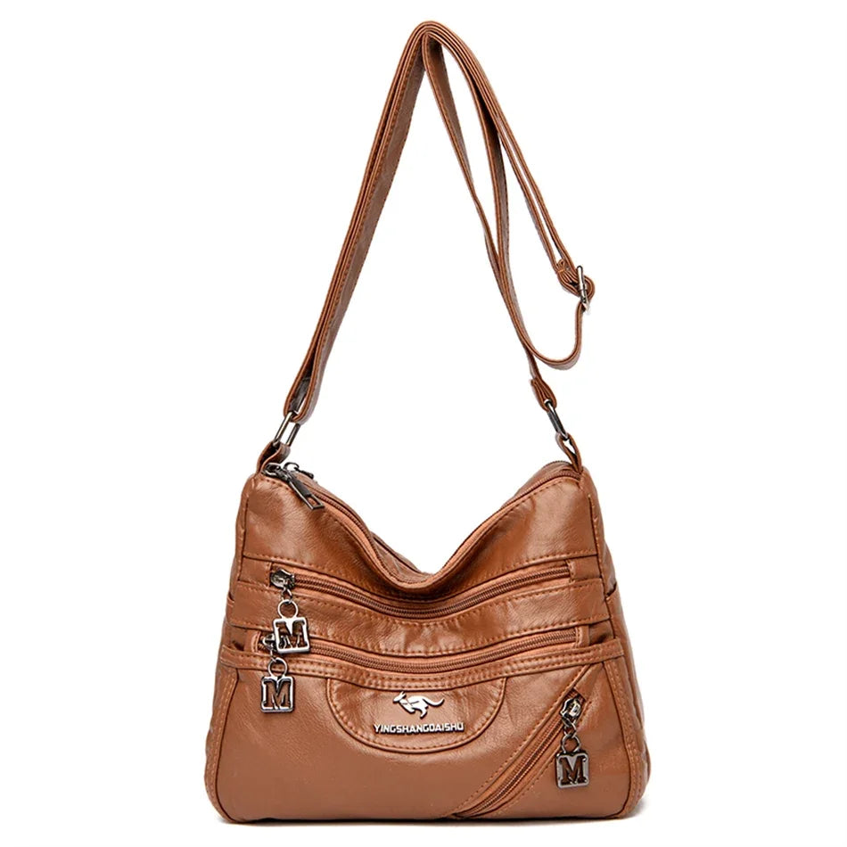 Classic brown leather shoulder bag with a sophisticated look, multi-compartment storage, and a detachable strap for versatility.