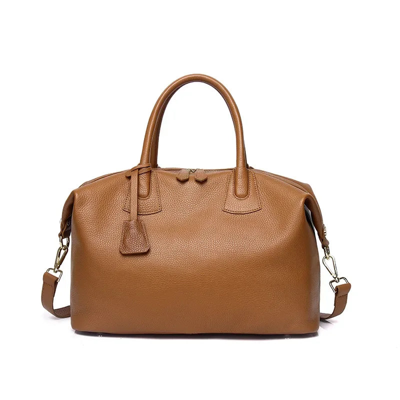 Brown leather handbag on a white background