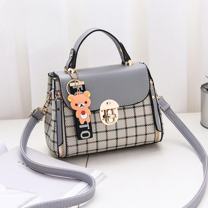 Chic Plaid Pattern Handbag with Charm Accents