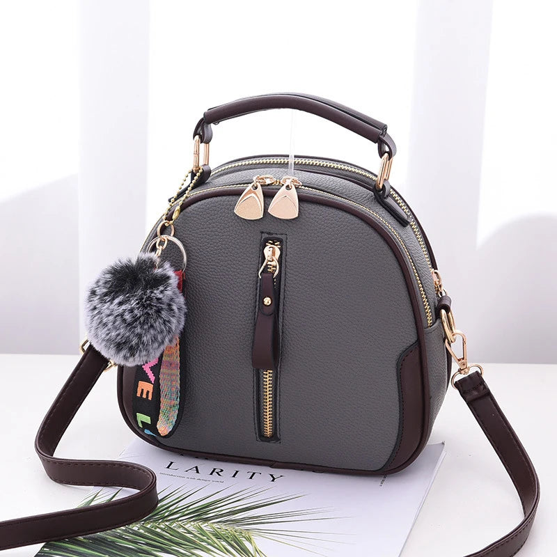 Chic Black Round Tote with Fur Charm