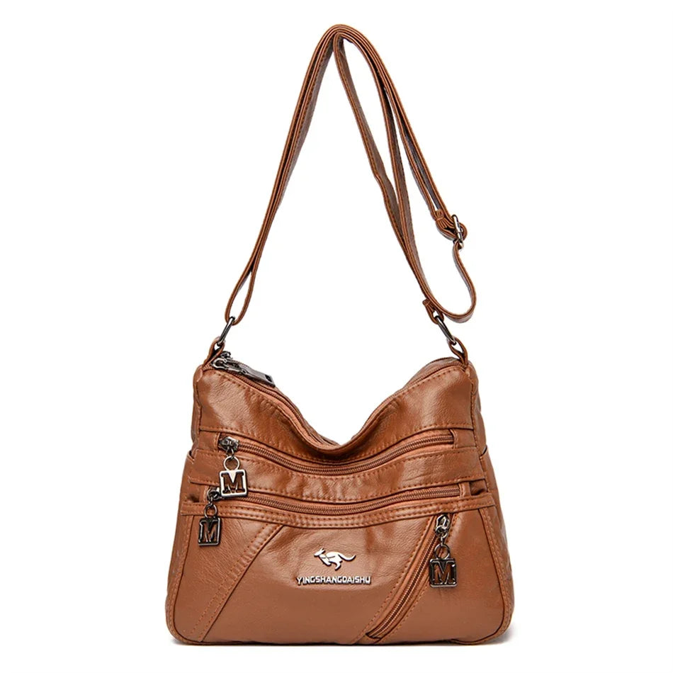 Classic brown leather shoulder bag with a sophisticated look, multi-compartment storage, and a detachable strap for versatility.