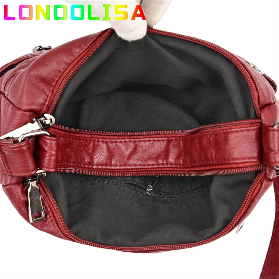 Interior view of the luxury soft leather crossbody bag in dark red, displaying spacious compartments with secure zipper closure. Perfect for organizing daily essentials.