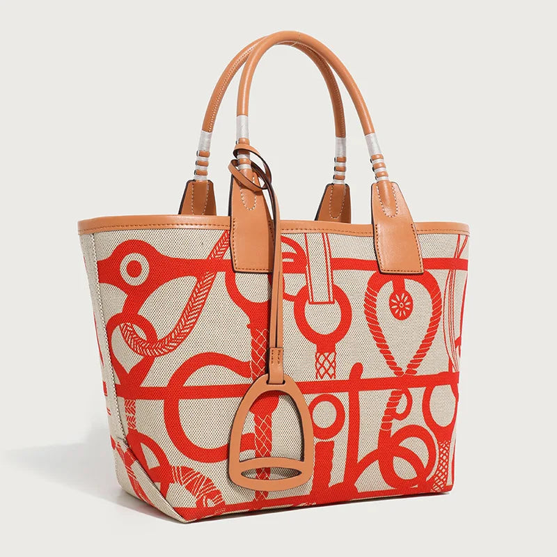 Tote bag with red and beige pattern on a light gray background
