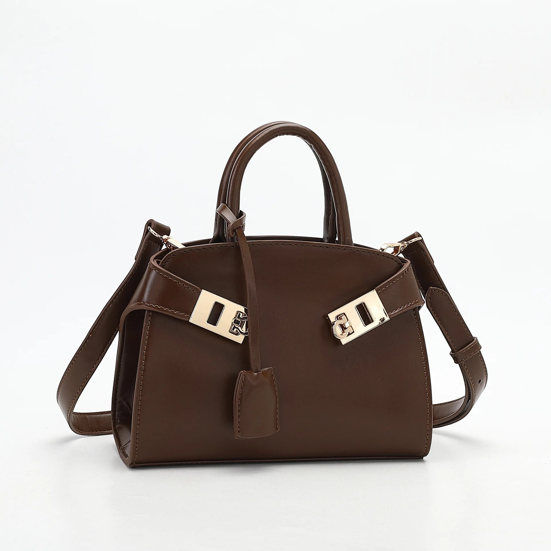 Brown handbag with gold accents on a white background