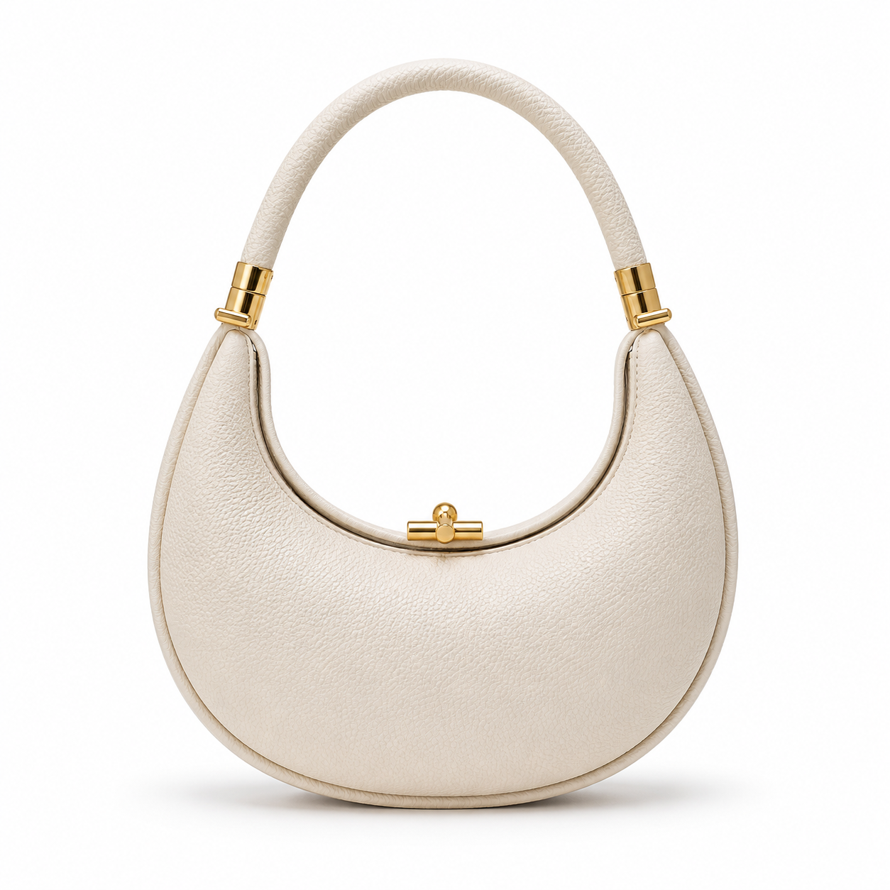 Ivory handbag with gold accents on a white background