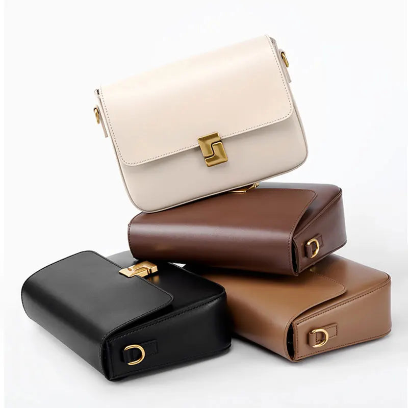 Four leather handbags in beige, brown, black, and brown on a white background