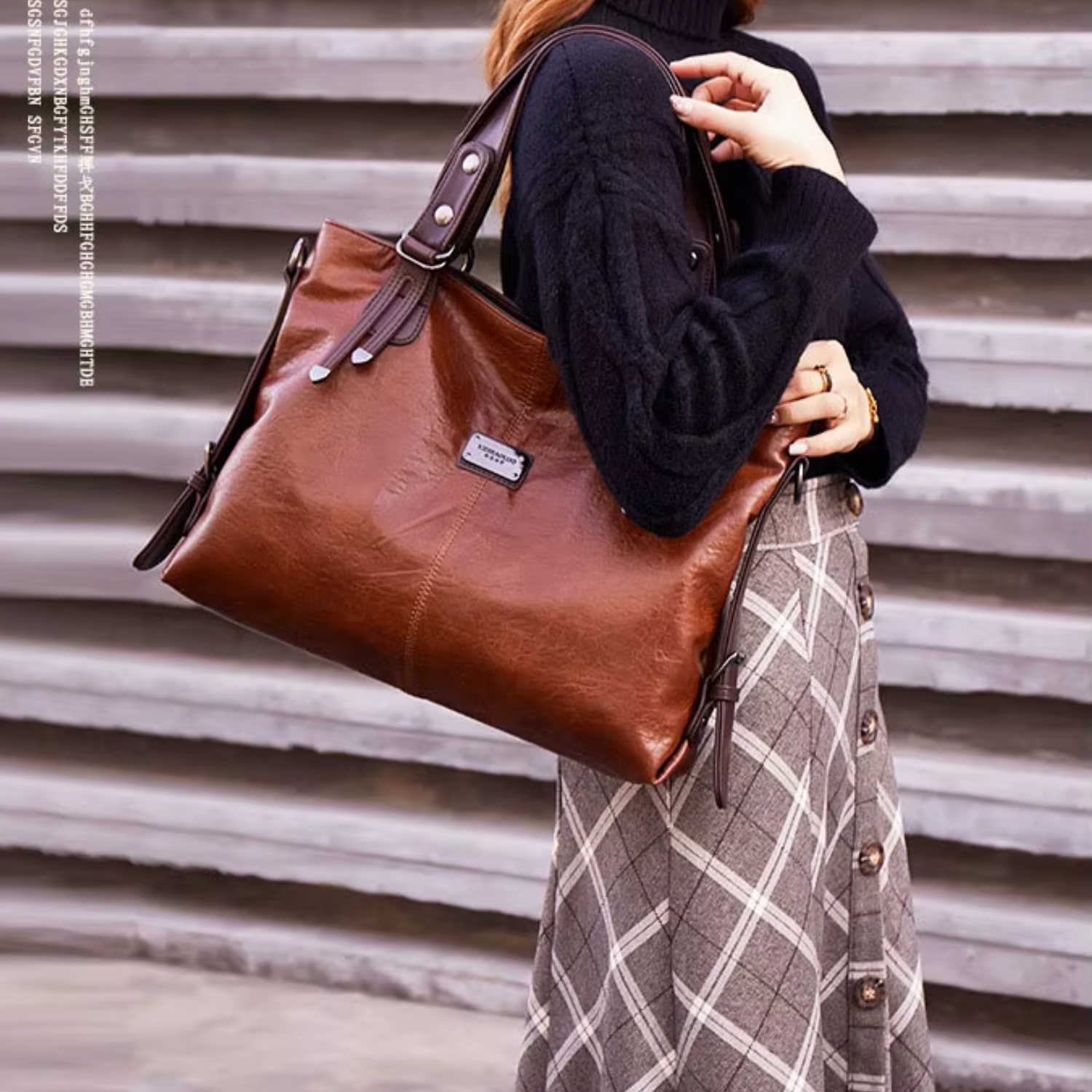 Stylish woman wearing a black sweater and plaid skirt, carrying a vintage brown leather tote bag over her shoulder.