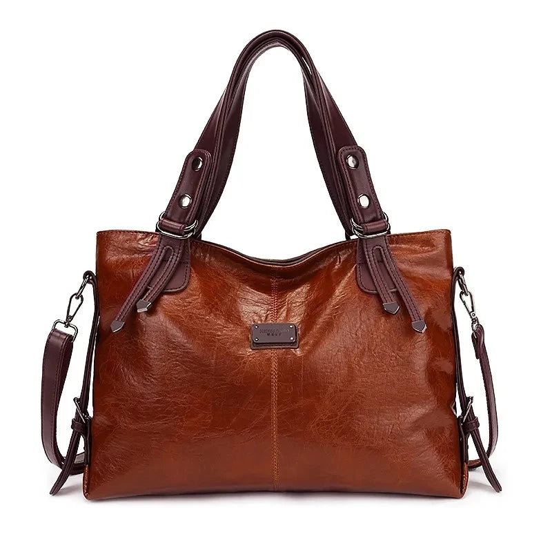 Vintage brown leather tote bag with dark brown handles and a detachable shoulder strap.