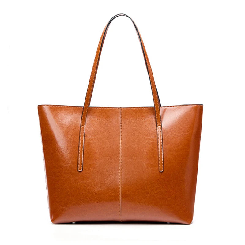 Brown leather tote bag on a white background