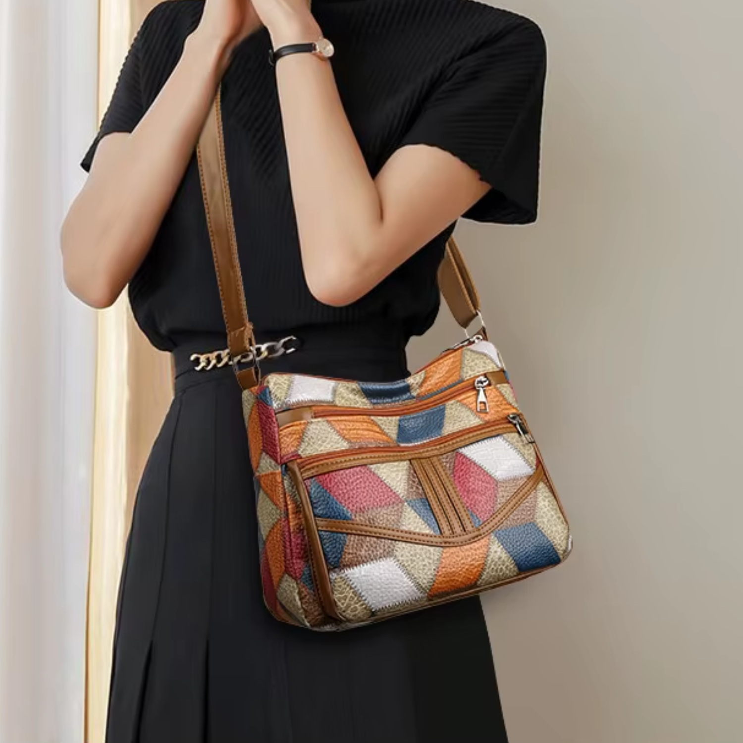 Woman wearing a vintage PU leather crossbody bag with geometric patchwork design.