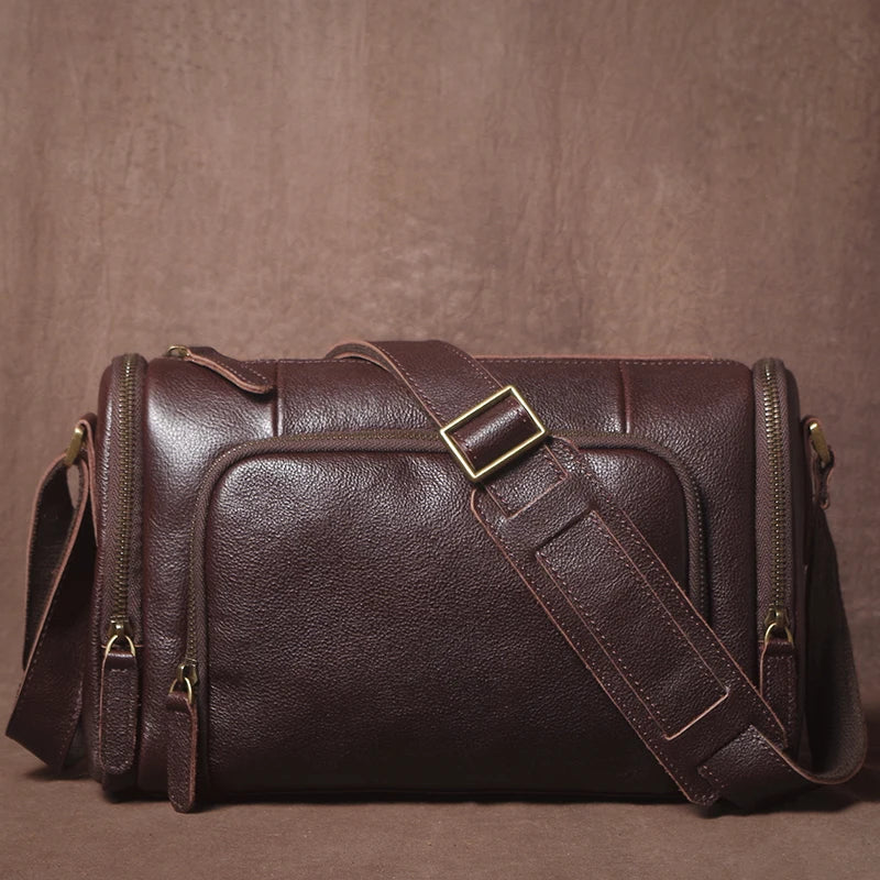 Brown leather bag with a strap on a brown background