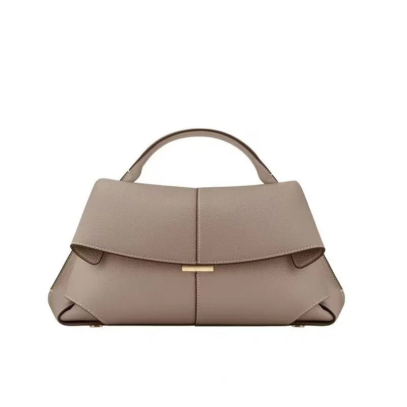 Beige handbag on a white background