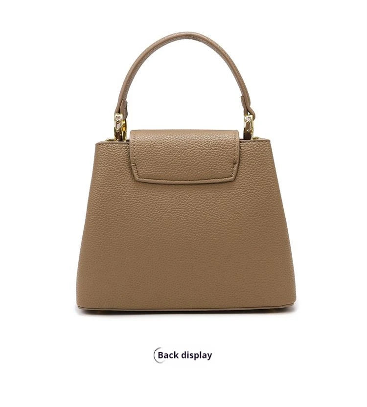 Beige handbag on a white background