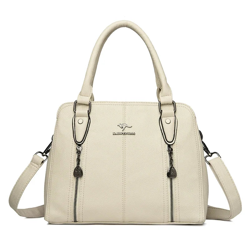 Beige handbag with a visible brand logo on a white background