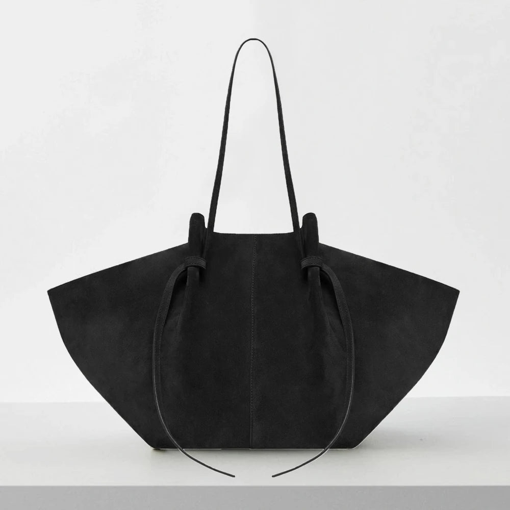 Black handbag on a white background