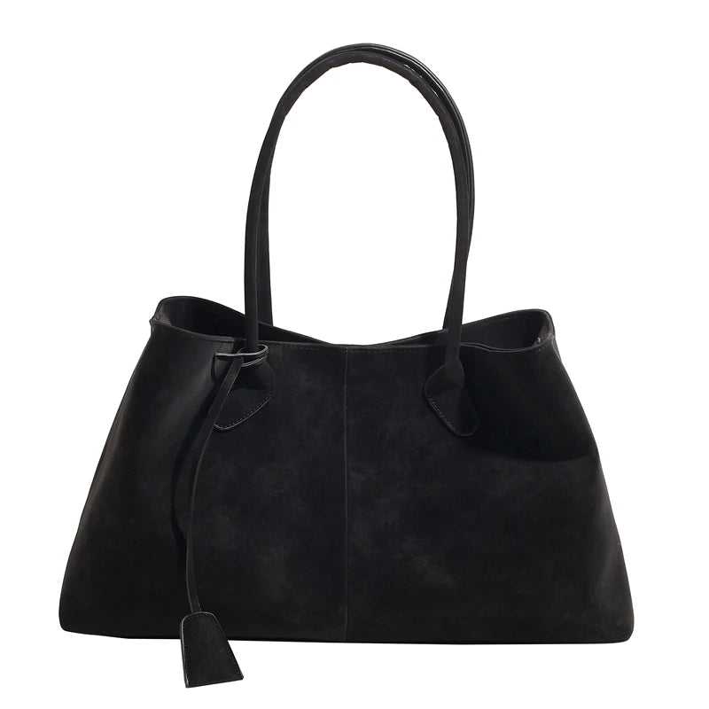 Black handbag with a drawstring on a white background