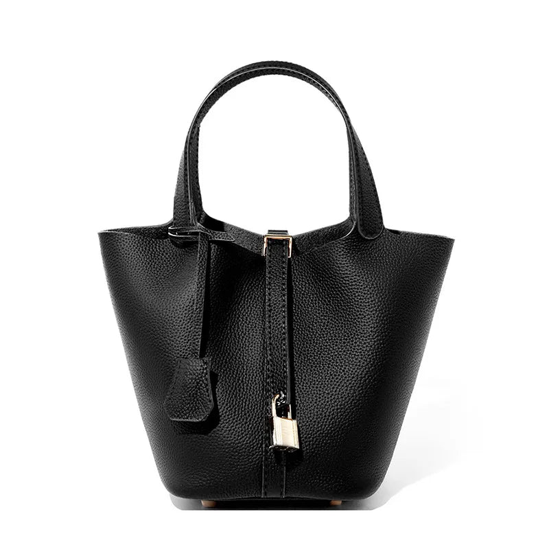 Black handbag with a gold clasp on a white background